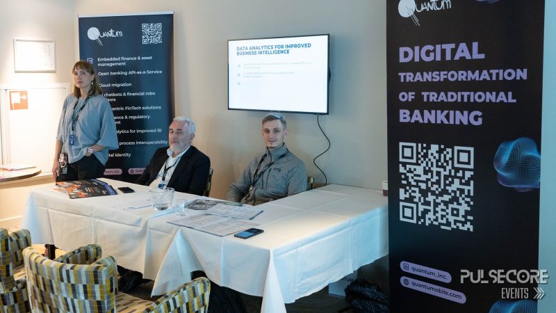 Panellists at a table beside a Digital Transformation of Traditional Banking banner at a previous PulseCore event