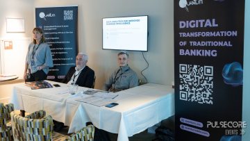 Panellists at a table beside a Digital Transformation of Traditional Banking banner at a previous PulseCore event