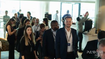 Delegates networking in the venue foyer at a previous PulseCore event