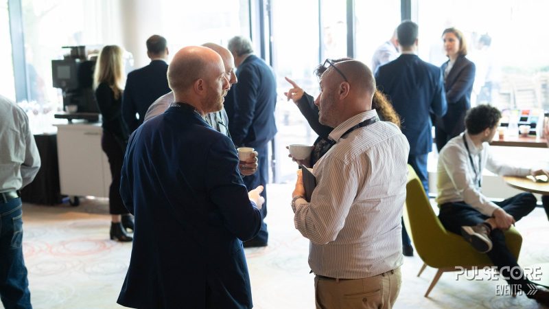 Delegates networking in the venue hall at a previous PulseCore event